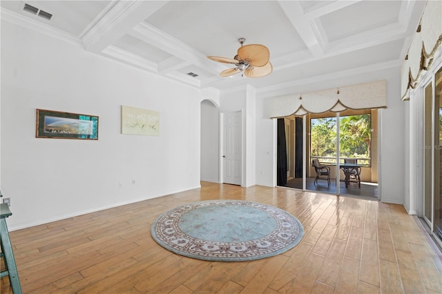 unfurnished room featuring ceiling fan, ornamental molding, coffered ceiling, and light wood-type flooring