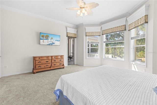 carpeted bedroom with crown molding and ceiling fan