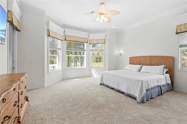 bedroom featuring ceiling fan, crown molding, and light carpet