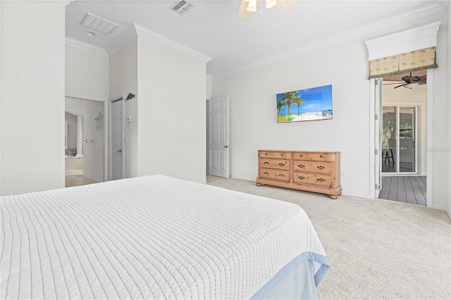 carpeted bedroom featuring crown molding and connected bathroom