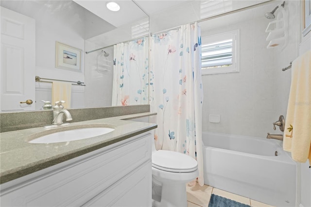 full bathroom featuring tile patterned flooring, vanity, toilet, and shower / bath combo with shower curtain