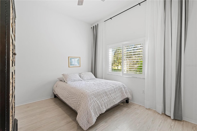 bedroom featuring light hardwood / wood-style floors and ceiling fan