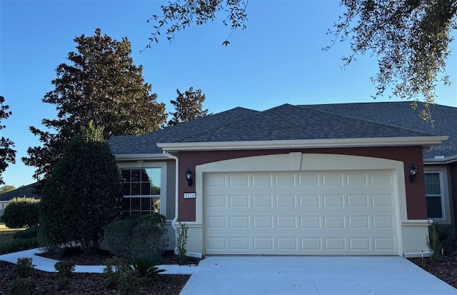 single story home with a garage