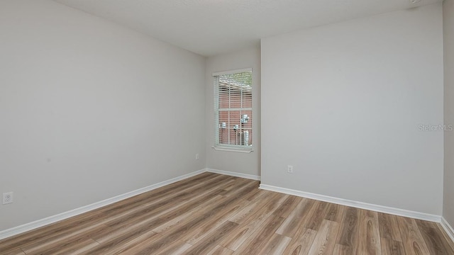 unfurnished room featuring light hardwood / wood-style flooring