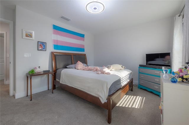 bedroom with light colored carpet