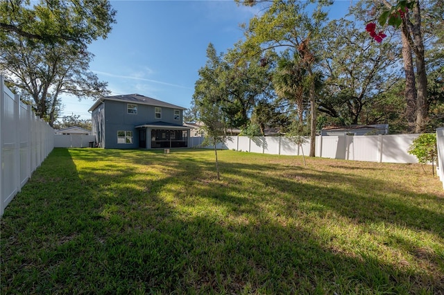 view of yard with a sunroom