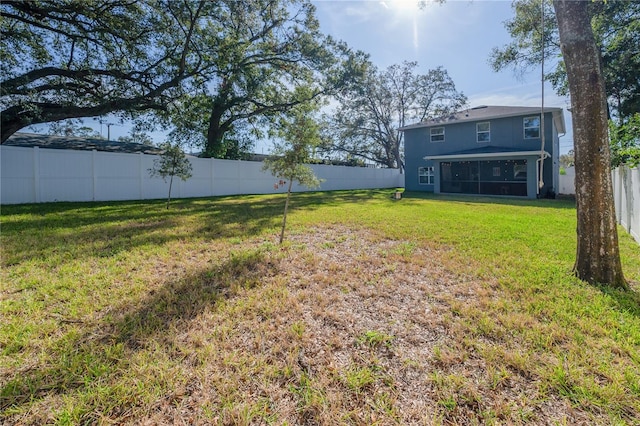 view of yard with a sunroom