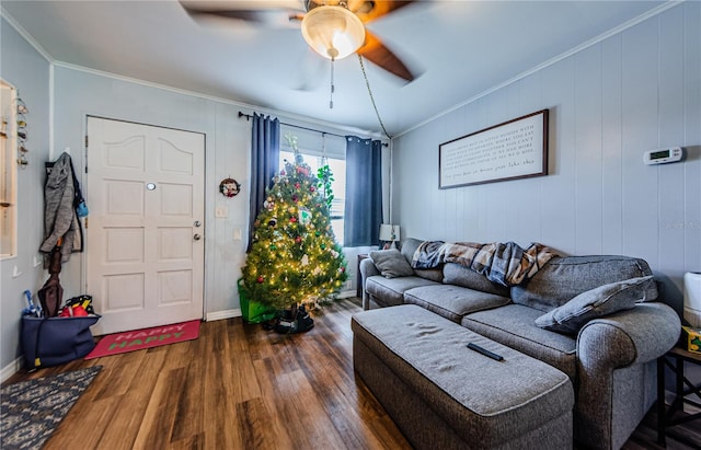 living room featuring ceiling fan, dark hardwood / wood-style flooring, and ornamental molding