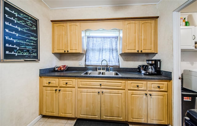 kitchen with sink and light tile patterned floors