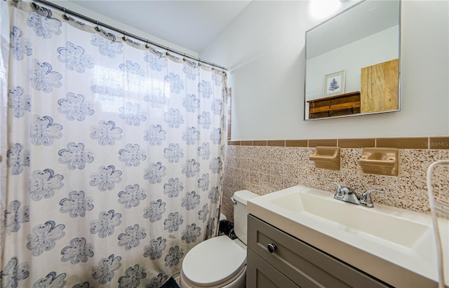 bathroom featuring toilet, vanity, tile walls, and a shower with shower curtain