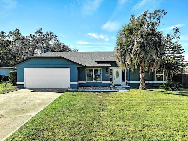 ranch-style house with a garage and a front lawn