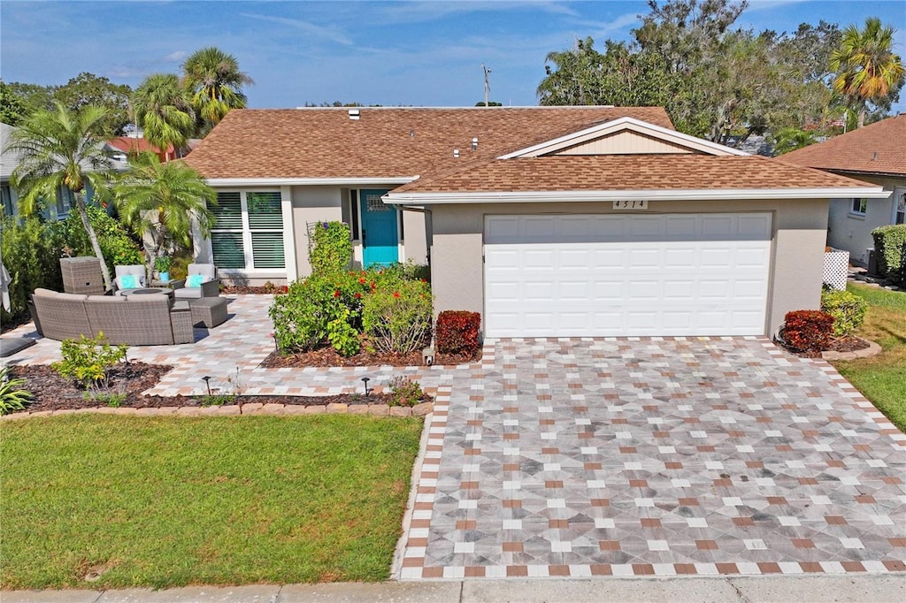 single story home with outdoor lounge area and a front lawn