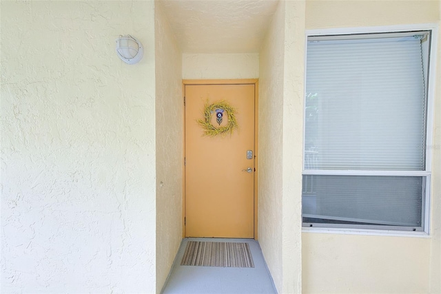 16308 Gulf Blvd Unit 303, Redington Beach, FL 33708 - doorway to property with stucco siding