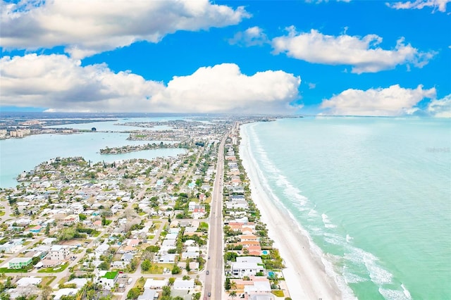 drone / aerial view with a water view and a beach view