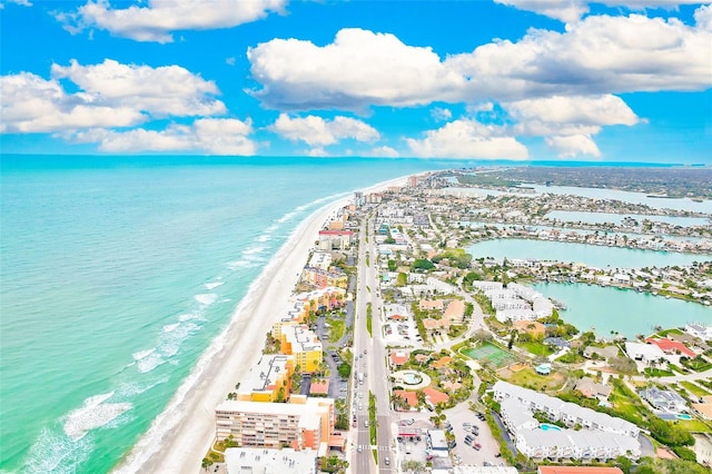 birds eye view of property featuring a water view and a view of the beach