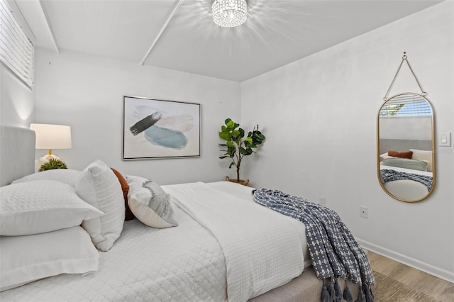 bedroom with wood-type flooring