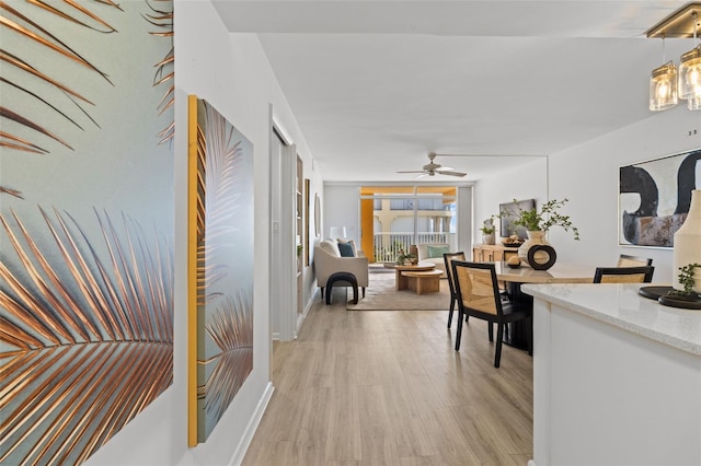 hallway with light hardwood / wood-style flooring