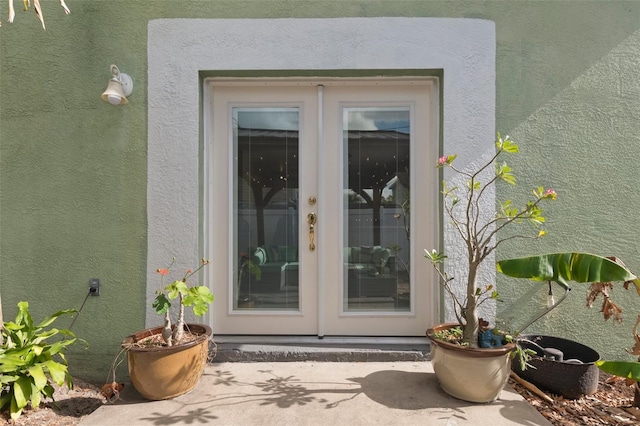 property entrance featuring french doors