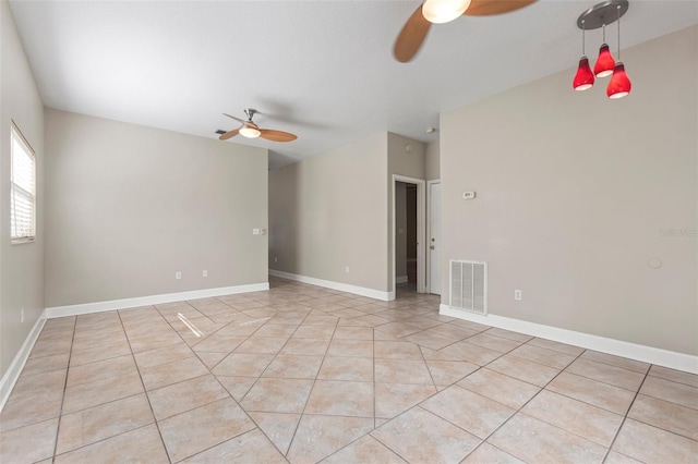 spare room featuring ceiling fan and light tile patterned floors