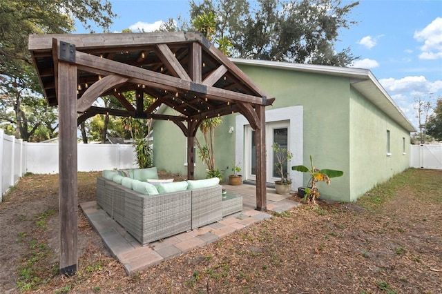 back of house with a gazebo, a patio, and an outdoor hangout area