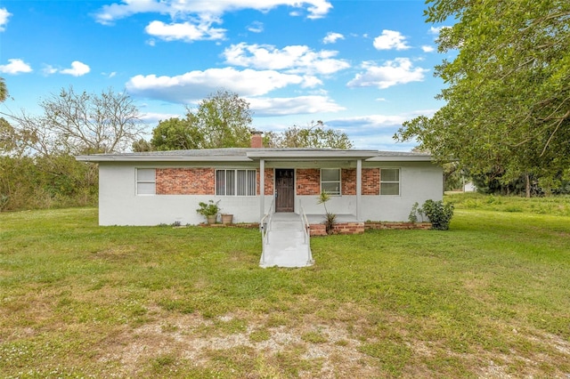 ranch-style home with a front lawn