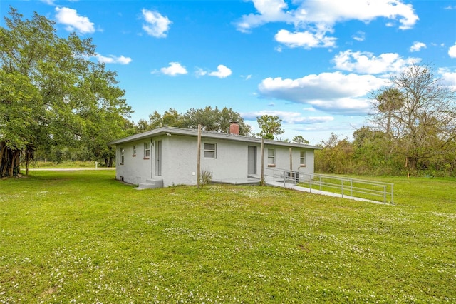 view of front of property with a front lawn