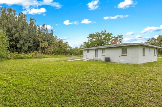 505 Sawyer Ave, Merritt Island, FL 32953 - view of green lawn with central AC