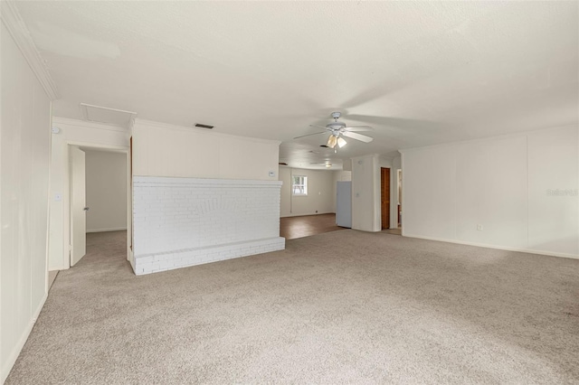 505 Sawyer Ave, Merritt Island, FL 32953 - unfurnished living room featuring carpet flooring, a ceiling fan, ornamental molding, and baseboards