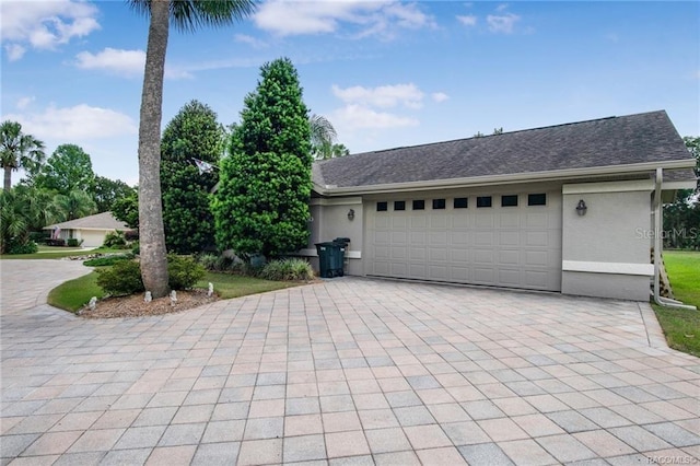 single story home with a garage