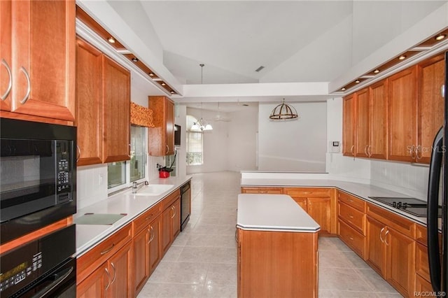 kitchen featuring black appliances, light tile patterned floors, a center island, hanging light fixtures, and lofted ceiling