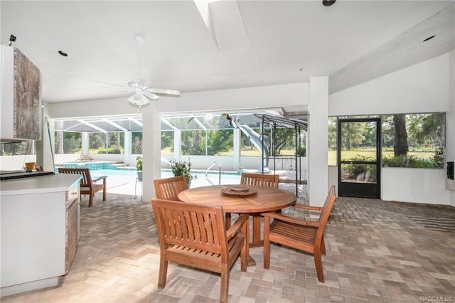 sunroom / solarium featuring a pool and ceiling fan