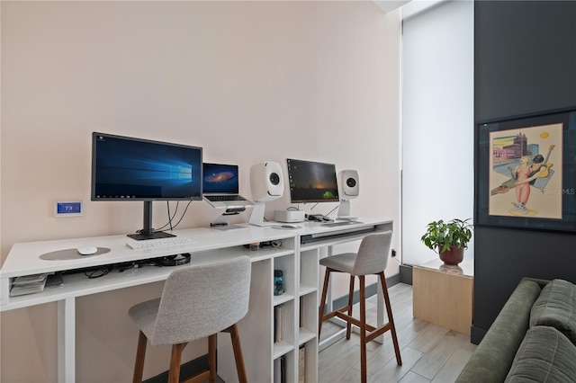 office space with light hardwood / wood-style floors