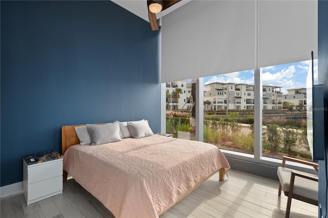 bedroom with hardwood / wood-style flooring