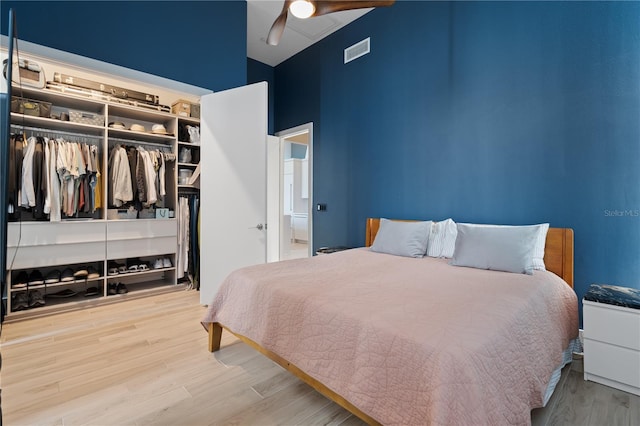 bedroom featuring a closet, ceiling fan, and hardwood / wood-style floors