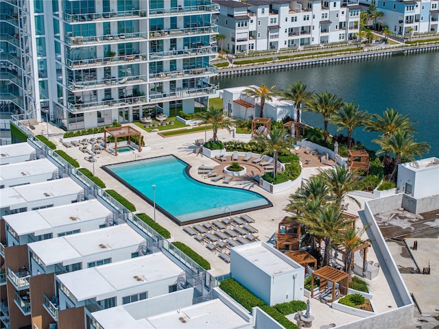 birds eye view of property with a water view