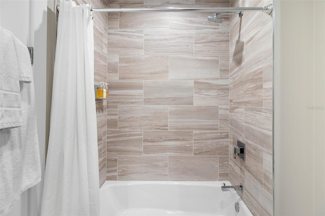 bathroom featuring shower / bathtub combination with curtain