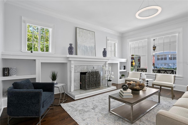 living room with a fireplace, hardwood / wood-style floors, and ornamental molding