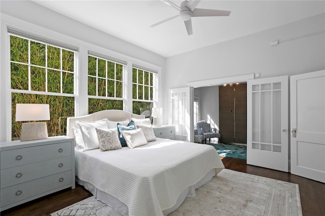 bedroom with ceiling fan and dark wood-type flooring