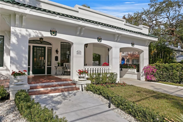 entrance to property with covered porch