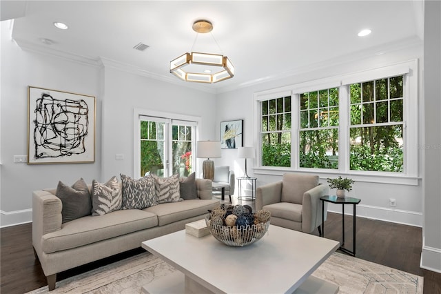 living room featuring hardwood / wood-style floors and ornamental molding