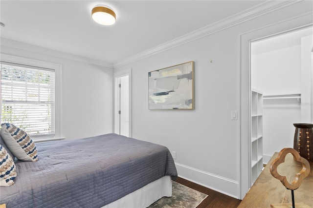 bedroom with crown molding and dark hardwood / wood-style flooring