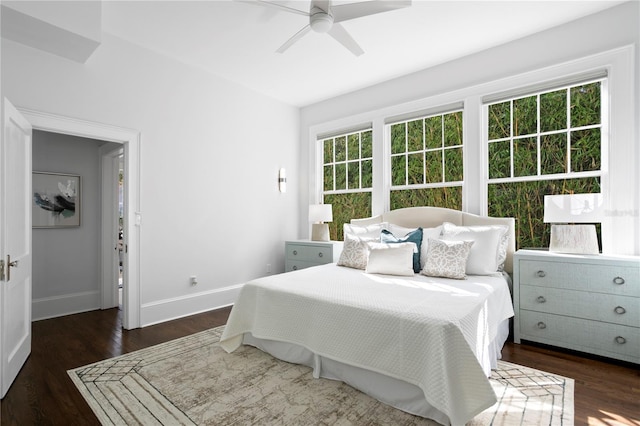 bedroom featuring ceiling fan and dark hardwood / wood-style floors