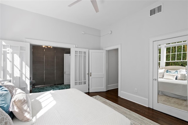 bedroom with ceiling fan and dark hardwood / wood-style flooring