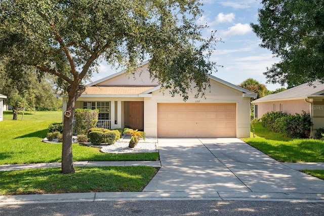 ranch-style home with a front yard and a garage