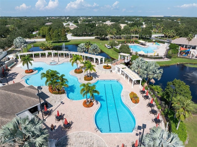 view of pool featuring a water view