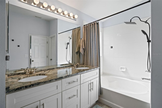 bathroom featuring shower / bath combination with curtain and vanity