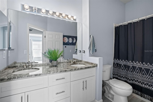 bathroom with a shower with curtain, vanity, and toilet