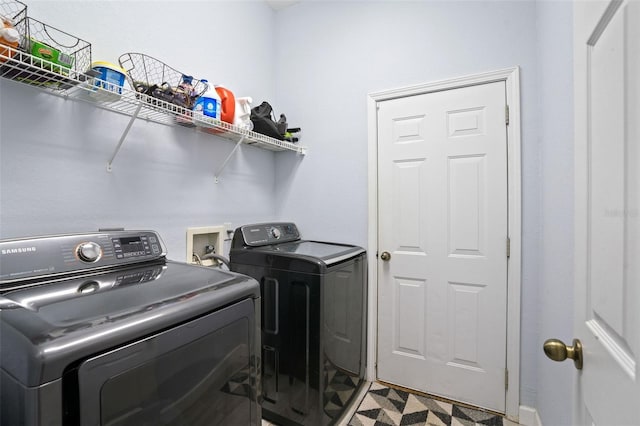 clothes washing area featuring washing machine and clothes dryer