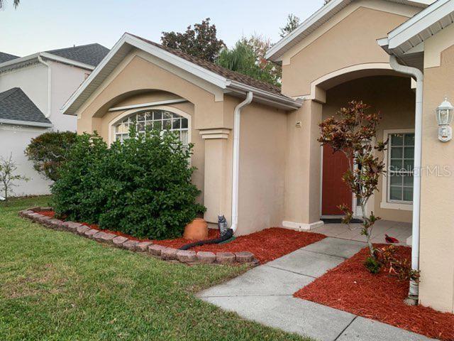 entrance to property with a yard