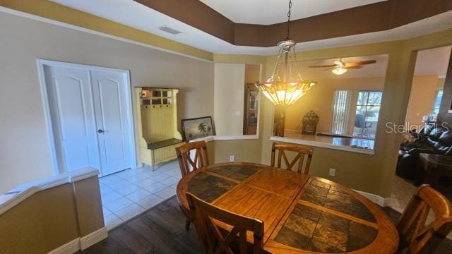 tiled dining room with ceiling fan